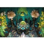 Gold stainless-steel Gem-frame end table with diamond-inspired geometry and glass top, ideal for luxury modern event lounge décor