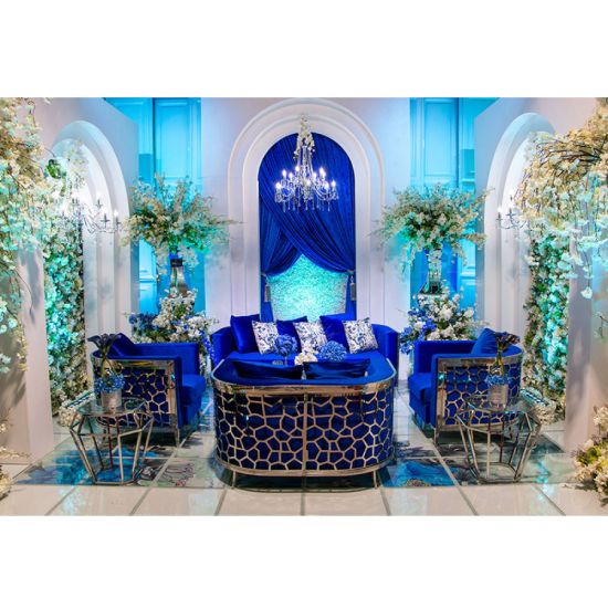 Royal Blue velvet Reflection Giraffe sofa with silver honeycomb metal cutout base and matching pillows, luxury seating for weddings and events.