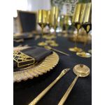 Geometric napkin holder with gold metal open-frame cube design holding a folded white cloth napkin, modern accent for event table settings
