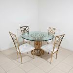 48″ round Lilou Reflection dining table with clear glass top and gold metal frame, ideal for luxury event dining and reception décor.