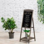 Freestanding wooden chalkboard easel sign with dark frame, ideal for wedding welcome sign or seating chart display.