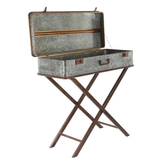 Vintage metal trunk-style end table on dark wood cross legs, industrial rustic accent furniture rental.