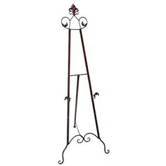 Black metal decorative easel stand with scroll details, used for displaying signs or frames at events.