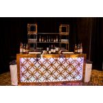 Art-Deco gold-metal front event bar rental unit with bold black geometric paneling “Reflection Bar 8′ Art Deco Extravaganza Gold-Black”