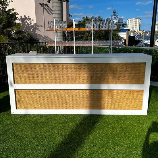 White cane-woven front event bar rental unit with smooth white frame and countertop for modern lounge-style weddings and cocktail receptions