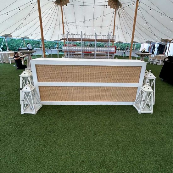White cane-woven front event bar rental unit with smooth white frame and countertop for modern lounge-style weddings and cocktail receptions