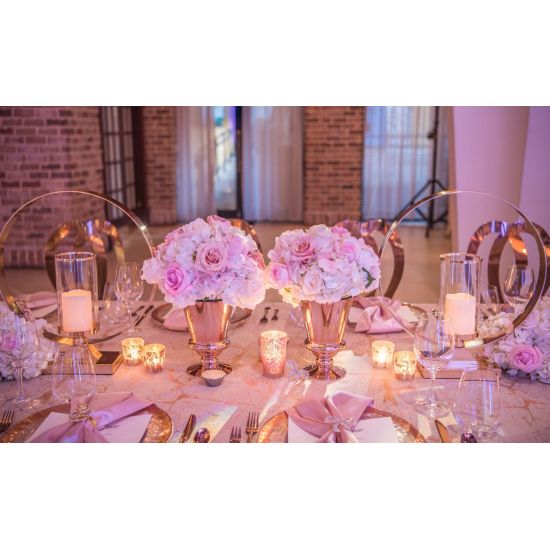 Modern ring candle holder with gold circular frame and clear glass cylinder, minimalist centerpiece décor for weddings and receptions.