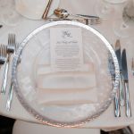 Clear cloud charger plate with subtle texture and wide silver rim, refined glass charger for formal weddings and upscale events