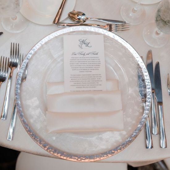 Clear cloud charger plate with subtle texture and wide silver rim, refined glass charger for formal weddings and upscale events
