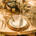 Clear rainbow charger plate with textured radial design and scalloped edge, classic glass charger for weddings and formal events