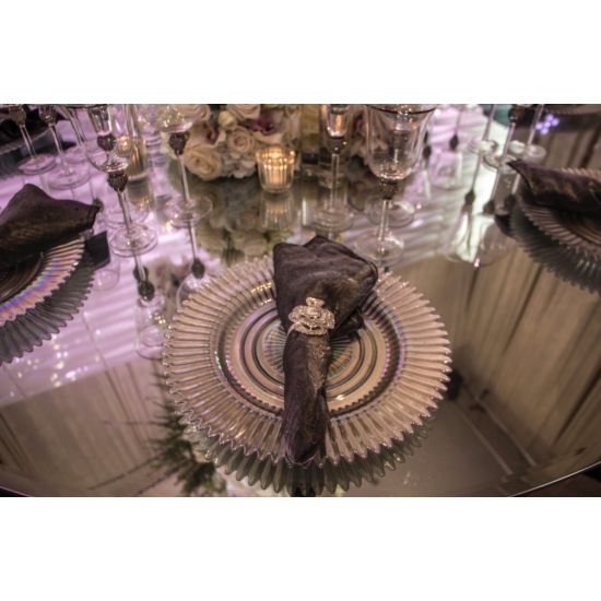 Clear rainbow charger plate with textured radial design and scalloped edge, classic glass charger for weddings and formal events