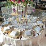 White pearl ribbon charger plate with textured surface and scalloped edge with gold rim, elegant charger for weddings and formal events