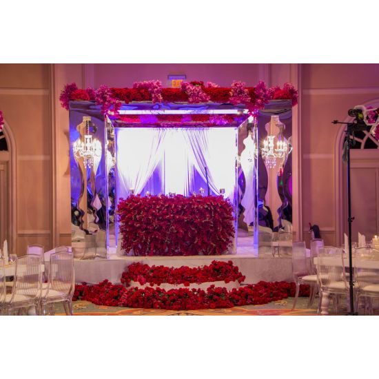 Pair of tall geometric columns in white and black with mirrored interior panels, modern event pedestals for décor and displays.