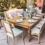 Vintage Tuscany accent chair with light upholstery, nailhead trim, and natural wood frame, classic seating for weddings and events.