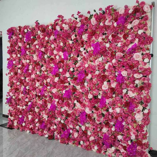 Bright fuchsia flower wall backdrop with dense mixed blooms, bold romantic photo backdrop panel for weddings and event décor styling.