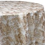 Gold and ivory Fushion abstract patterned metallic round event tablecloth on banquet table for weddings and upscale celebrations