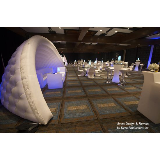 White inflatable event arch with smooth curved design, modern decorative structure ideal for entrances, photo backdrops, and special event styling
