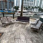 Black velvet lounge armchair with polished silver frame and open square base, modern luxury seating for upscale event lounges.