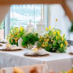 Boho chic wood bead napkin ring with natural wooden beads and rustic texture securing a folded white cloth napkin for event table settings
