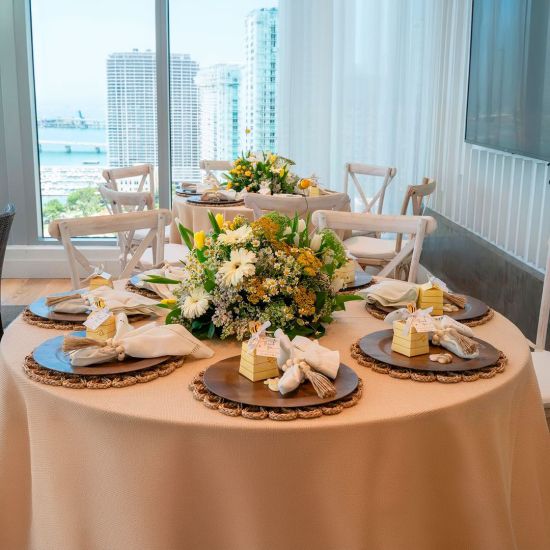Boho chic wood bead napkin ring with natural wooden beads and rustic texture securing a folded white cloth napkin for event table settings