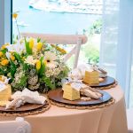 Boho chic wood bead napkin ring with natural wooden beads and rustic texture securing a folded white cloth napkin for event table settings