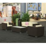 Mocha rattan armchair with woven frame and white cushion, modern outdoor lounge chair rental for weddings and events.