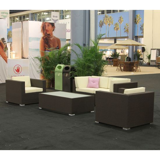Mocha rattan armchair with woven frame and white cushion, modern outdoor lounge chair rental for weddings and events.