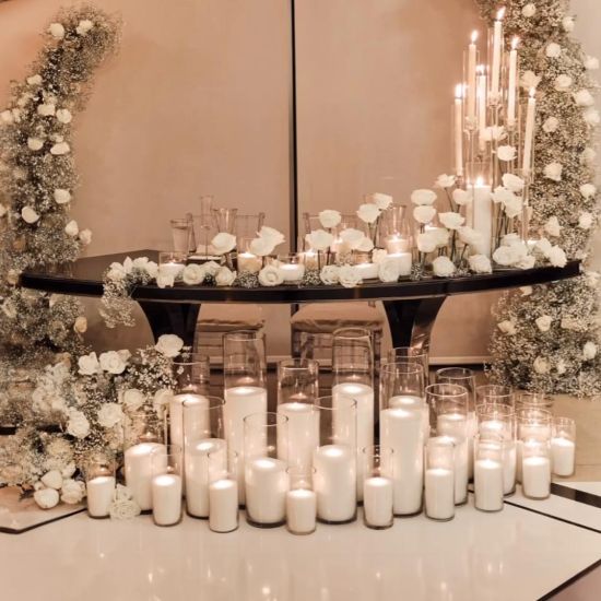 Reflection Serpentine gold table with stainless steel top, curved serpentine dining table with gold legs for luxury event rentals and décor.