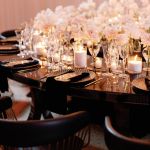 Reflection Serpentine gold table with stainless steel top, curved serpentine dining table with gold legs for luxury event rentals and décor.