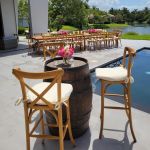 Rustic wooden barrel with metal bands and aged finish, western decor rental for events, photo setups, and cocktail styling.