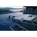 Clear acrylic stage platform 2x4 with metal truss base, modular riser for events, runway staging, and performances.